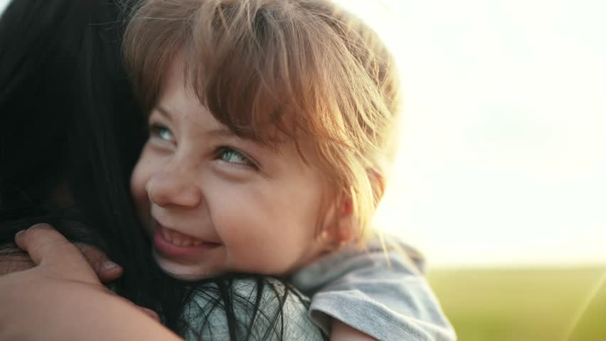 daughter hugging mom. happy family a kid dream concept. mother carries her daughter in her arms walk in the park in nature. child hugging lifestyle mother neck. mother walks with a child in nature Royalty-Free Stock Footage #1105307435