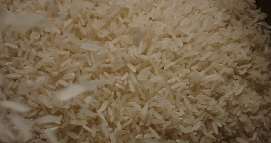 Falling Rice wooden bowl cup. Top view slow motion zoom out. Close Up of a bunch of rice being poured into cup. nature farm products rich vitamin antioxidant. Japanese clean food ingredient Royalty-Free Stock Footage #1105309631