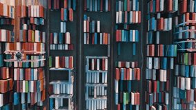 Logistic business or transport concept 
 Aerial top down view over import export port. A lot of containers are gathered at the port and loaded onto a cargo ship.  - Powered by Shutterstock - Get 15% off with code: PIKWIZARD15