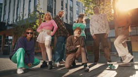 Group Of Young And Stylish Men And Women Posing And Looking At Camera In Slow Motion. Male And Female Fashionable Friends Representing Youth Subcultures. Creative People Hanging Out Together Downtown. - Powered by Shutterstock - Get 15% off with code: PIKWIZARD15