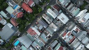 Aerial view of the Asian city. Drone top down view on the sunny day. White tall buildings