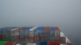Ultra large container ship full of cargo containers passing through the snow storm in Pacific ocean during winter time.  - Powered by Shutterstock - Get 15% off with code: PIKWIZARD15