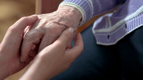 Helping hands, care for the elderly concept. High quality 4k, video.