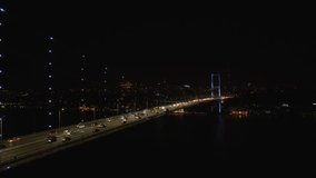 Aerial view of Istanbul Bosphorus Bridge (15 Temmuz Şehitler Köprüsü) with Blue Light. 4K Video in Turkey