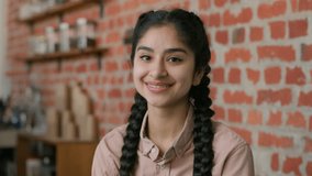 Portrait indian arabian successful smiling girl female manager small business owner cafeteria coffee shop happy woman businesswoman entrepreneur barista waitress look camera posing in cafe restaurant - Powered by Shutterstock - Get 15% off with code: PIKWIZARD15