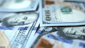 Hundred dollar bills close up in camera slow motion. Dollars American banknotes value of 100. Close-Up of banknotes. Dollars money. Cash of hundred dollar bills. - Powered by Shutterstock - Get 15% off with code: PIKWIZARD15