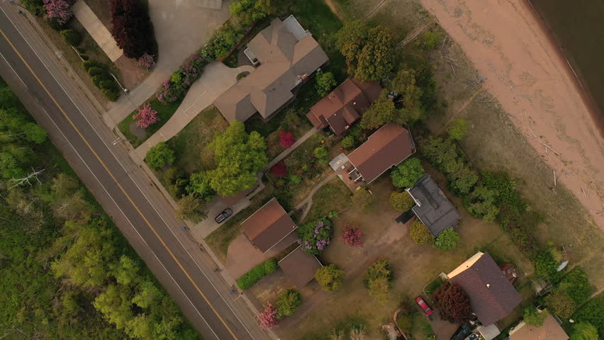 Aerial view of Minnesota Point, neighborhood of Duluth, Minnesota, United States. Park Point separates Lake Superior from Superior Bay and the Duluth Harbor Basin. Spring Summer, sunset