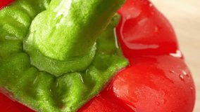 In a macro video, vibrant red bell peppers shimmer with glistening droplets of water. The probe lens captures every intricate detail, showcasing the peppers' velvety texture and radiant color. 
 - Powered by Shutterstock - Get 15% off with code: PIKWIZARD15