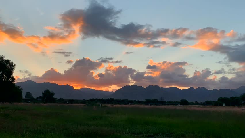 This golden hour with the orange clouds talk about God.