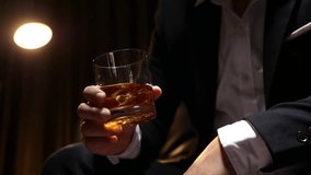 Businessmen in suits drinking  Celebrate whiskey - Powered by Shutterstock - Get 15% off with code: PIKWIZARD15