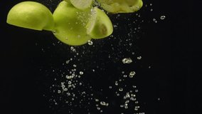green apple falling into the water, slow motion  - Powered by Shutterstock - Get 15% off with code: PIKWIZARD15