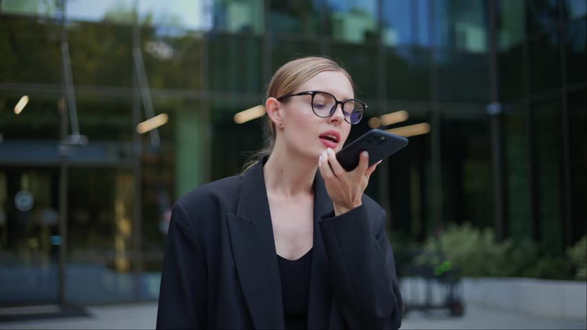 Distressed Young Businesswoman in Glasses Doesn't Understand Why There is No Cellular Connection or Wifi Internet Signal on Her Smartphone, Raises Mobile Phone Upwards, Trying to Catch Signal. Royalty-Free Stock Footage #1105347021