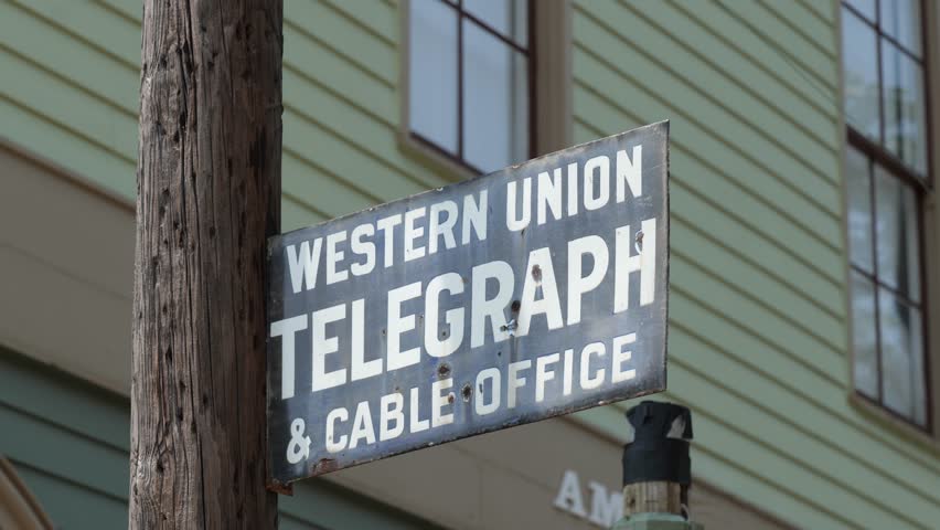 Historic Western Union, metal sign in front of a period hotel