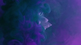 Vertical video. Paint water splash. Flower smoke. Underwater blossom. Purple blue color pigment vapor cloud revealing blooming daisy petals on dark abstract art background.