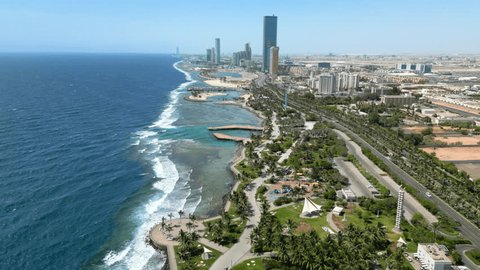 Jeddah, Saudi Arabia: Aerial view of coastal city and famous resort town, blue waters of Red Sea - landscape panorama of Arabian Peninsula from aboveの動画素材