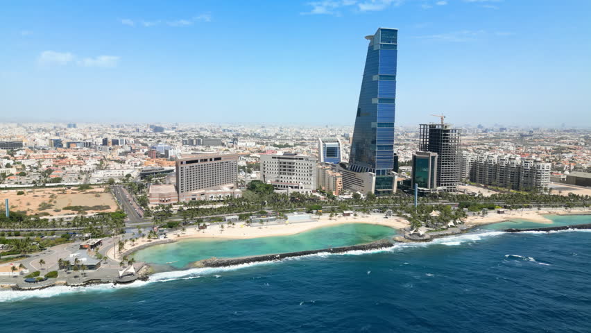 Jeddah: Aerial view of famous coastal city in v Saudi Arabia, skyline of The Headquarters Business Park, leisure area Roshn Waterfront, Red Sea - landscape panorama of Arabian Peninsula from above Royalty-Free Stock Footage #1105348449