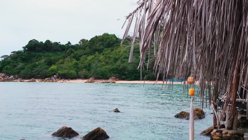 On this beach from epic idyllic landscape created by nature with blue surface of water and sandy shores you can hide from tiring restless thoughts. Beautiful amazing landscape of sea, forest, beach.
