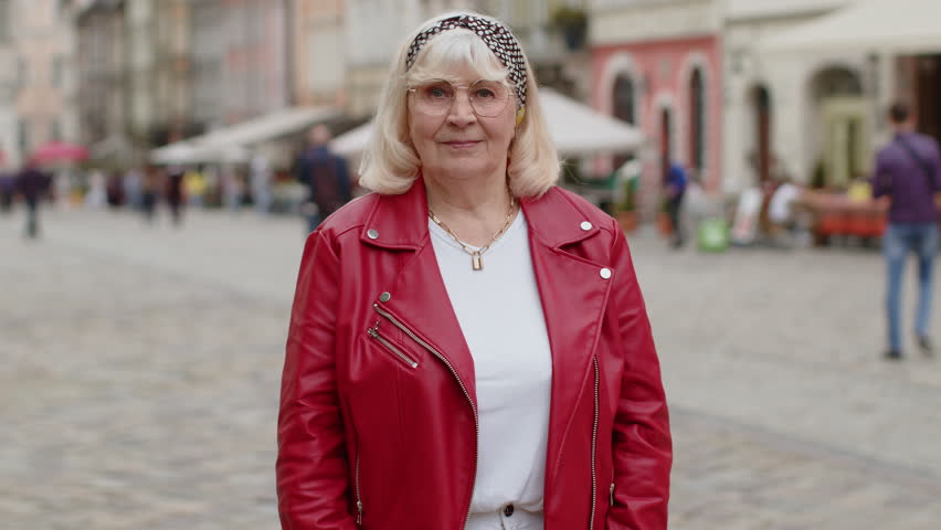 Like. Happy senior woman looking approvingly at camera showing thumbs up, like sign positive something good positive feedback. Elderly grandmother walking in urban city street. Town lifestyles outdoor | Shutterstock HD Video #1105349973
