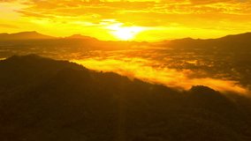Hyperlapse Video 4K, Aerial View Beautiful morning landscape with fog and mist, the sun shining golden. Shine through the mist over Pang Puai Village, Mae Moh, Lampang, Thailand.
