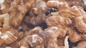 Close-up of walnuts. Healthy vegan food. Macro video