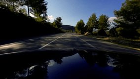 Driving car in the summer. Country side winding road with mountains.  3840x2160 4k hyperlapse video footage
