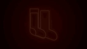 Glowing neon line Socks icon isolated on black background. 4K Video motion graphic animation.