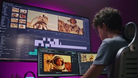 Young editor, video maker edits movie with astronauts, works at home office. Film footage and software interface with tools and sound tracks on PC and big digital screen. Concept of post production.