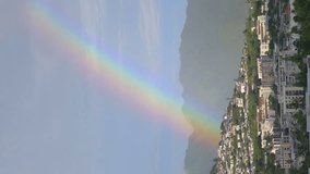Vertical video of beautiful rainbow above Honolulu Hawaii in 4k slow motion 60fps - Powered by Shutterstock - Get 15% off with code: PIKWIZARD15