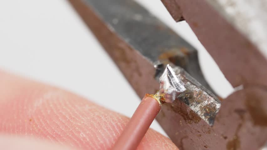 Cutting the wire with wire cutters and Wire stripping. the process of removing the insulation or outer layer of the wire to expose the metal part and ensure a secure connection. Royalty-Free Stock Footage #1105360909