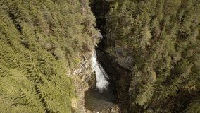 Big waterfall from mountain river in Campo Tures village in Italy. Famous waterfall in the heart of the Dolomites