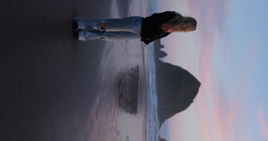 Blonde, Happy young Woman Modeling by Haystack Rock on Cannon Beach, Oregon Royalty-Free Stock Footage #1105374849
