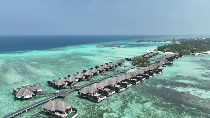 aerial view, Asia, Maldives, North Male Atoll, Kuda Huraa,  Four Season Maldives, , with beaches and water bungalows Royalty-Free Stock Footage #1105379667