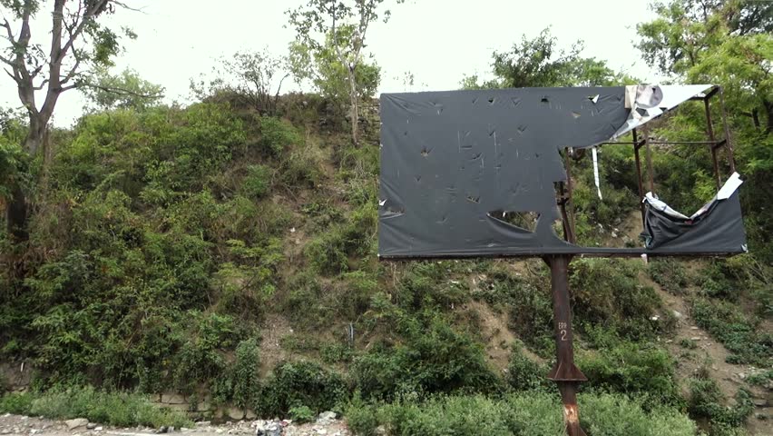 october 14th 2022, Dehradun City, Uttarakhand, India. An empty torn black bill board.