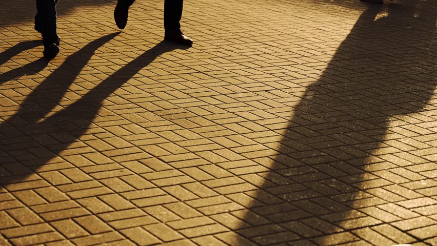Silhouette of anonymous people walking around the city. Close up, evening Royalty-Free Stock Footage #1105386467