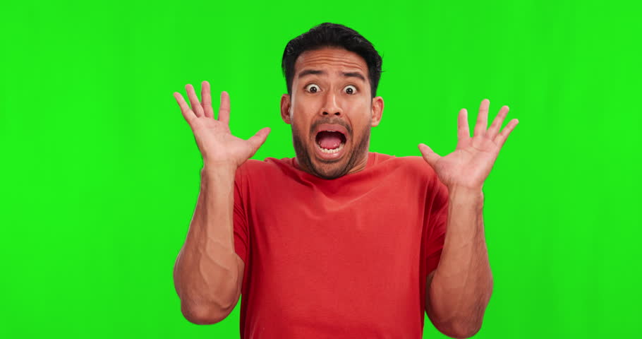 Shocked, scared and face of man on green screen for fear, horror and announcement. Surprise, alert and notification with portrait of person on studio background for drama, danger and scary mockup Royalty-Free Stock Footage #1105387465