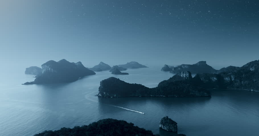 Lonely speed boat in night sea. Aerial moonlight island mountain silhouette on light blue background top view. Moon glow starry dramatic sky over ocean. Tropical travel concept. Bali, indonesia.