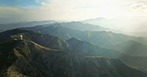 Heavenly Horizons: Serenading the Senses with Breathtaking Aerial Views of Majestic Mountain Landscapes During Enchanting Sunset Moments. High quality 4k footage