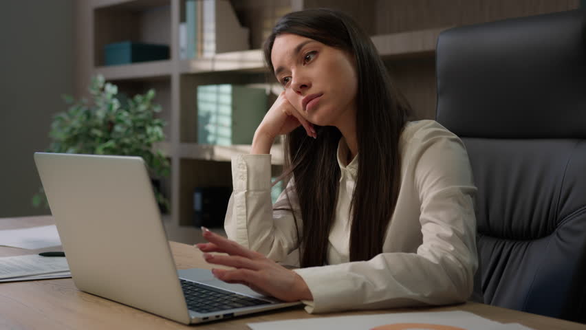 Bored sad upset tired exhausted Caucasian female office worker girl fatigued unmotivated business woman manager disinterested boring laptop work lazy businesswoman thinking boredom working burnout Royalty-Free Stock Footage #1105402049