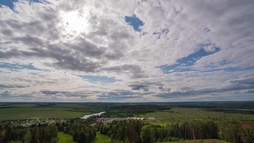white clouds floating in the sky and beautiful landscape. Blue sky white clouds. Puffy fluffy white clouds. Cumulus cloud cloudscape timelapse. Summer blue sky time lapse. Nature weather blue sky