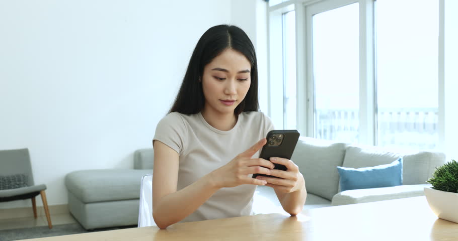 Lucky Asian woman read pleasant news on cellphone, get discount and sell-out notification, relish great news in sms feels happy, receive pleasant message. On-line auction winner enjoy moment victory Royalty-Free Stock Footage #1105408829