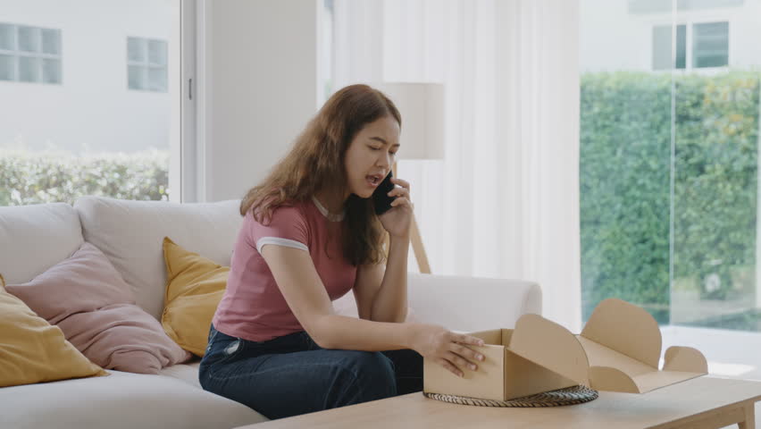 Upset asia people young Gen Z anger argue fight phone call on damage post mail box buy at home online shop retail store. Shock sad rude woman unbox wrong product order bad shipping CRM buyer service. Royalty-Free Stock Footage #1105408919