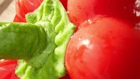 Vibrant red bell peppers glisten with droplets of water in this mesmerizing macro video. The probe lens captures every detail, showcasing their freshness and inviting texture. Bell peppers background
 - Powered by Shutterstock - Get 15% off with code: PIKWIZARD15