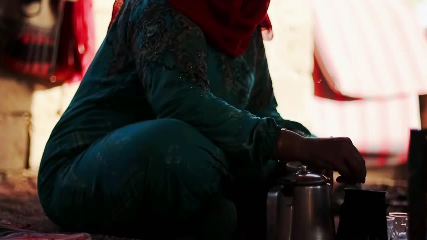 Bedouin woman cooking tea in Bedouin village, Egypt Royalty-Free Stock Footage #1105414147