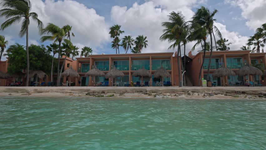 Beautiful view of sand beach with hotel from Atlantic ocean side. Aruba.