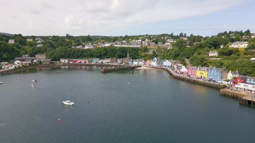 This is an aerial drone shot of the town Tobermory. An little fishing town on the north-east side of the Isle of Mull. a small island on the the west side of Scotland. Royalty-Free Stock Footage #1105420607
