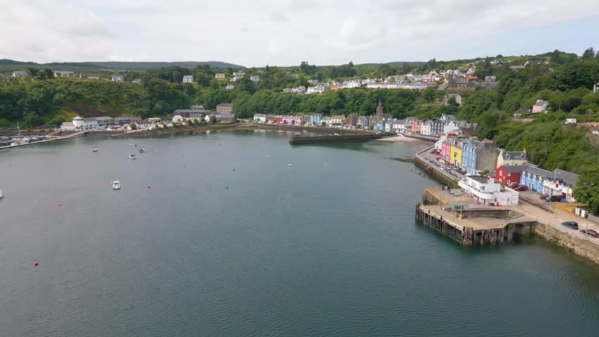 This is an aerial drone shot of the town Tobermory. An little fishing town on the north-east side of the Isle of Mull. a small island on the the west side of Scotland. Royalty-Free Stock Footage #1105420613