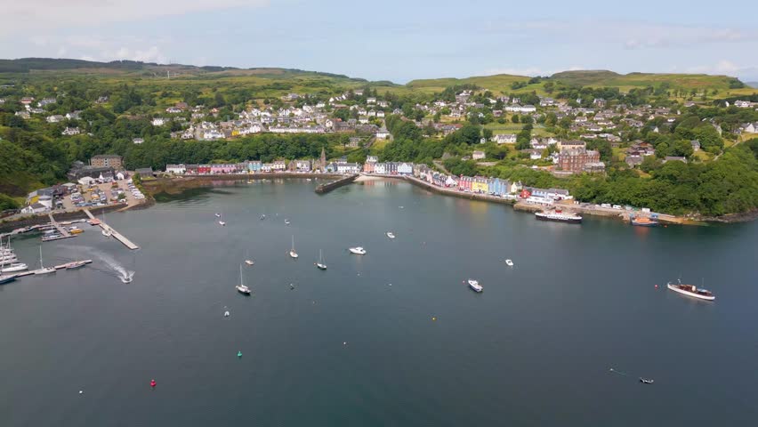 This is an aerial drone shot of the town Tobermory. An little fishing town on the north-east side of the Isle of Mull. a small island on the the west side of Scotland. Royalty-Free Stock Footage #1105420615