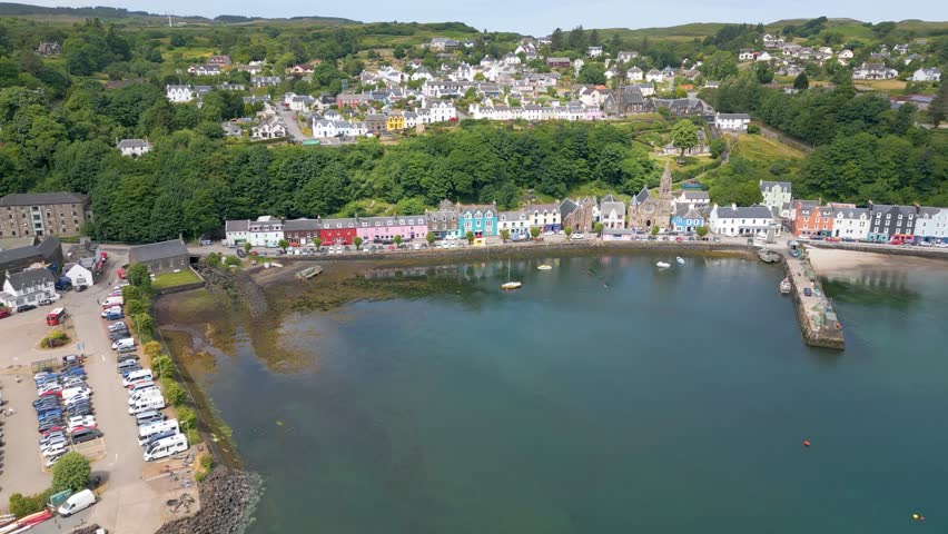 This is an aerial drone shot of the town Tobermory. An little fishing town on the north-east side of the Isle of Mull. a small island on the the west side of Scotland. Royalty-Free Stock Footage #1105420617