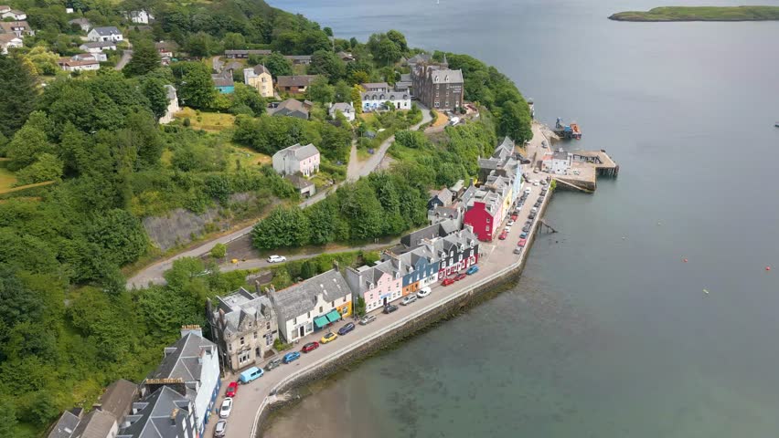This is an aerial drone shot of the town Tobermory. An little fishing town on the north-east side of the Isle of Mull. a small island on the the west side of Scotland. Royalty-Free Stock Footage #1105420621