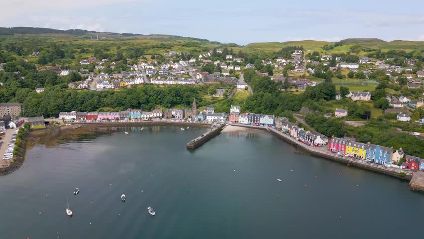 This is an aerial drone shot of the town Tobermory. An little fishing town on the north-east side of the Isle of Mull. a small island on the the west side of Scotland. Royalty-Free Stock Footage #1105420645
